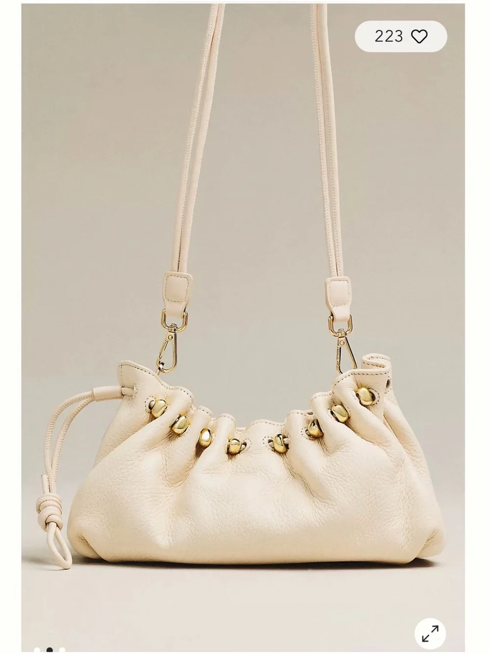 Dolce Vita Cream Tassel Drawstring Crossbody Bag with Gold Charms